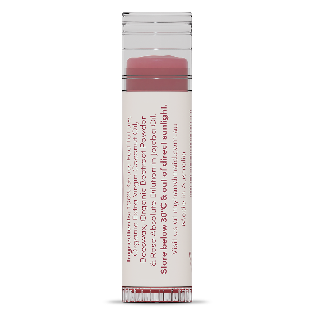 Rear view of a myhandmaid rose natural lip balm tube showing the storage instructions, website, "Made in Australia" text, and ingredients list including grass-fed tallow, organic extra virgin coconut oil, beeswax, organic beetroot powder, and rose absolute dilution in jojoba oil.