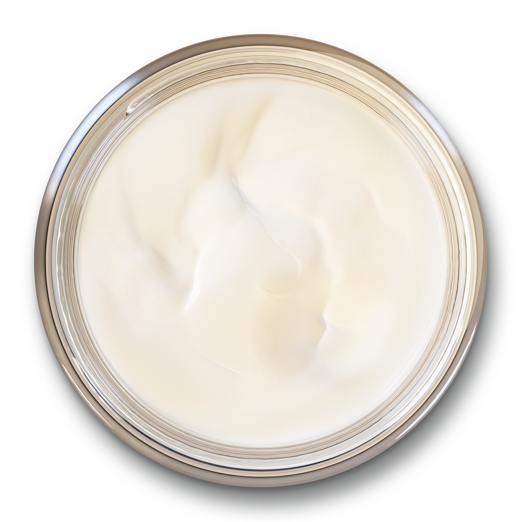 Top-down view of an open glass skincare jar filled with a smooth, creamy white tallow face and body balm.